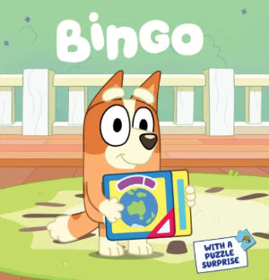 Cartoon dog character named Bingo holding a book with a puzzle surprise on a green background.
