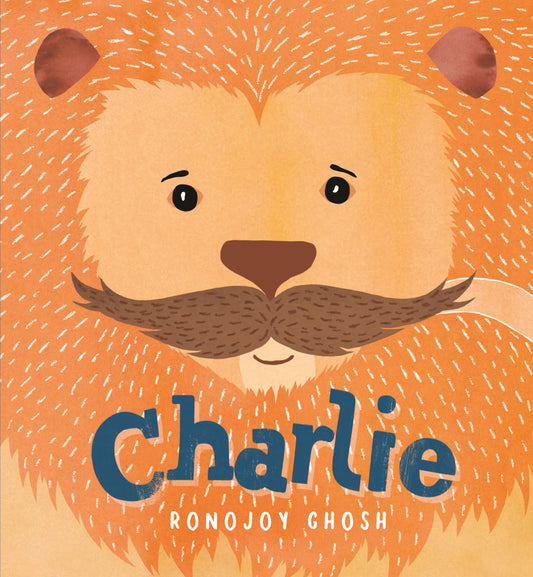 Book cover with a lion's face and the name 'Charlie' on an orange background