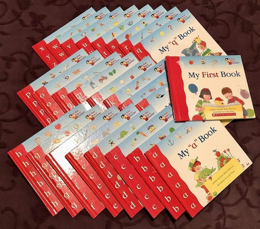 Set of children's books with colorful covers and educational designs on a brown background