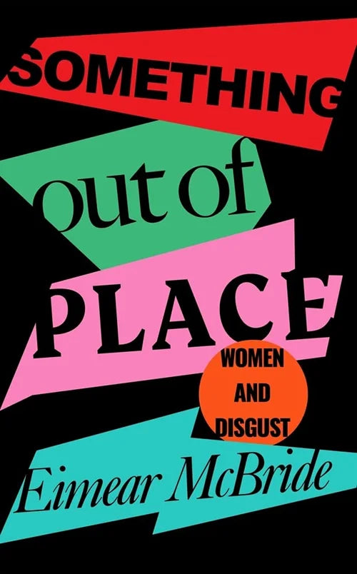 Book cover of 'Something Out of Place' by Eimear McBride with colorful geometric shapes on a black background.