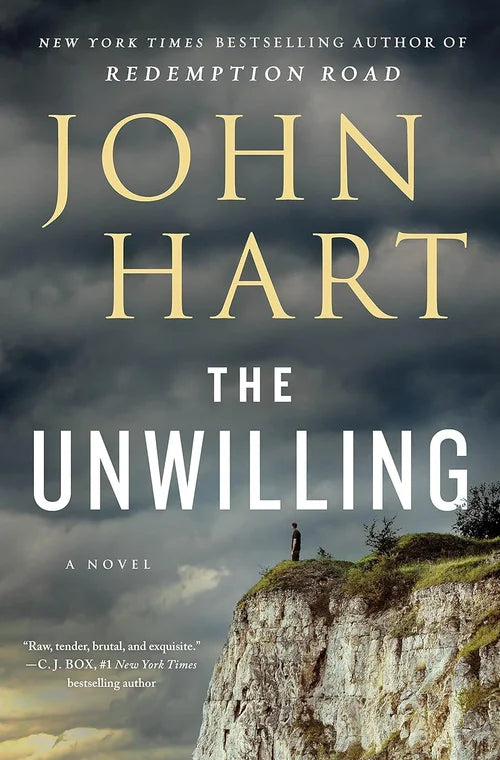 Book cover of 'The Unwilling' by John Hart with a person on a cliff under a stormy sky.